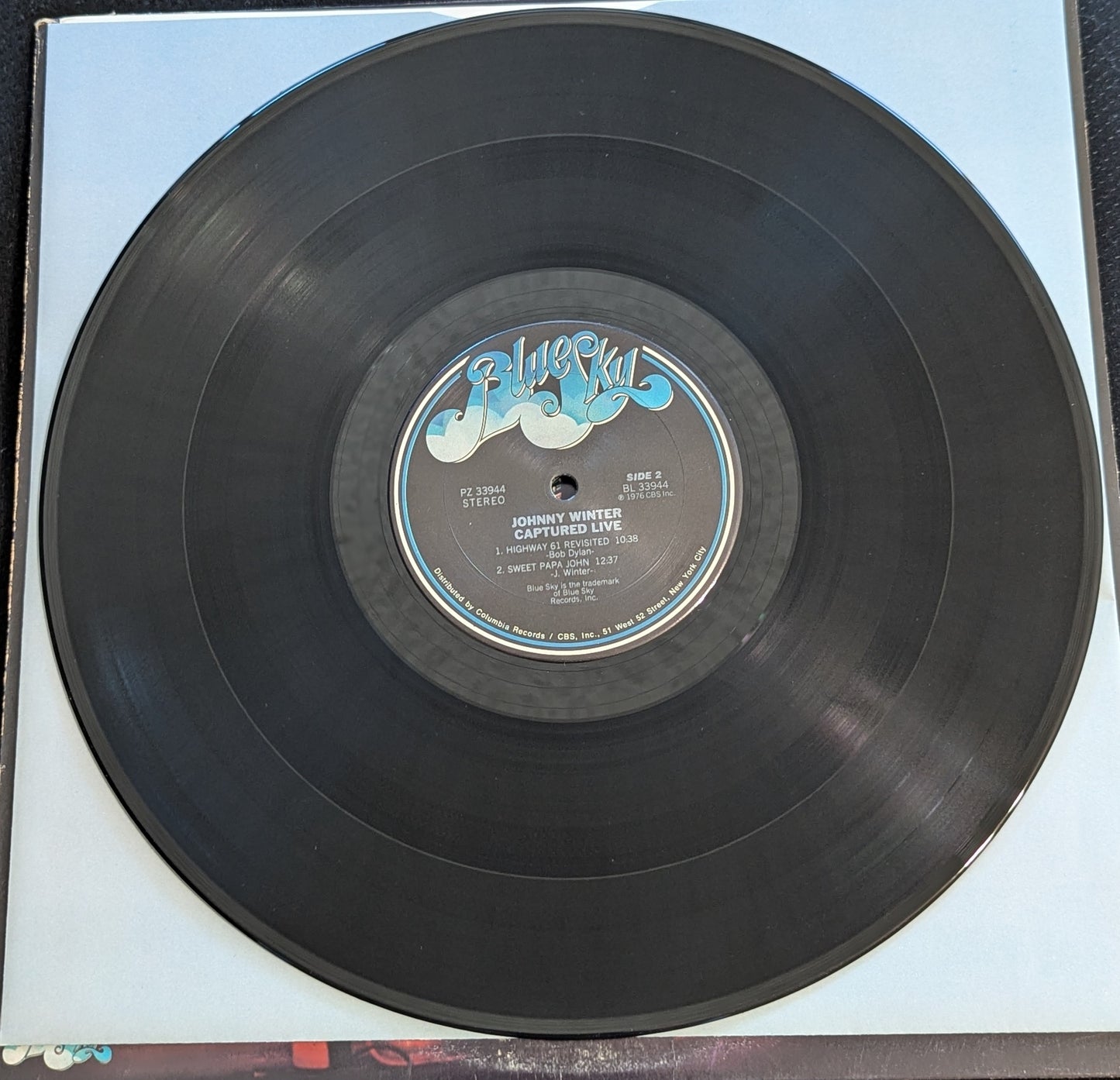 JOHNNY WINTER Captured Live LP Vinyl Record 1976 Blue Sky PZ 33944 (VG Vinyl, G+ Sleeve)