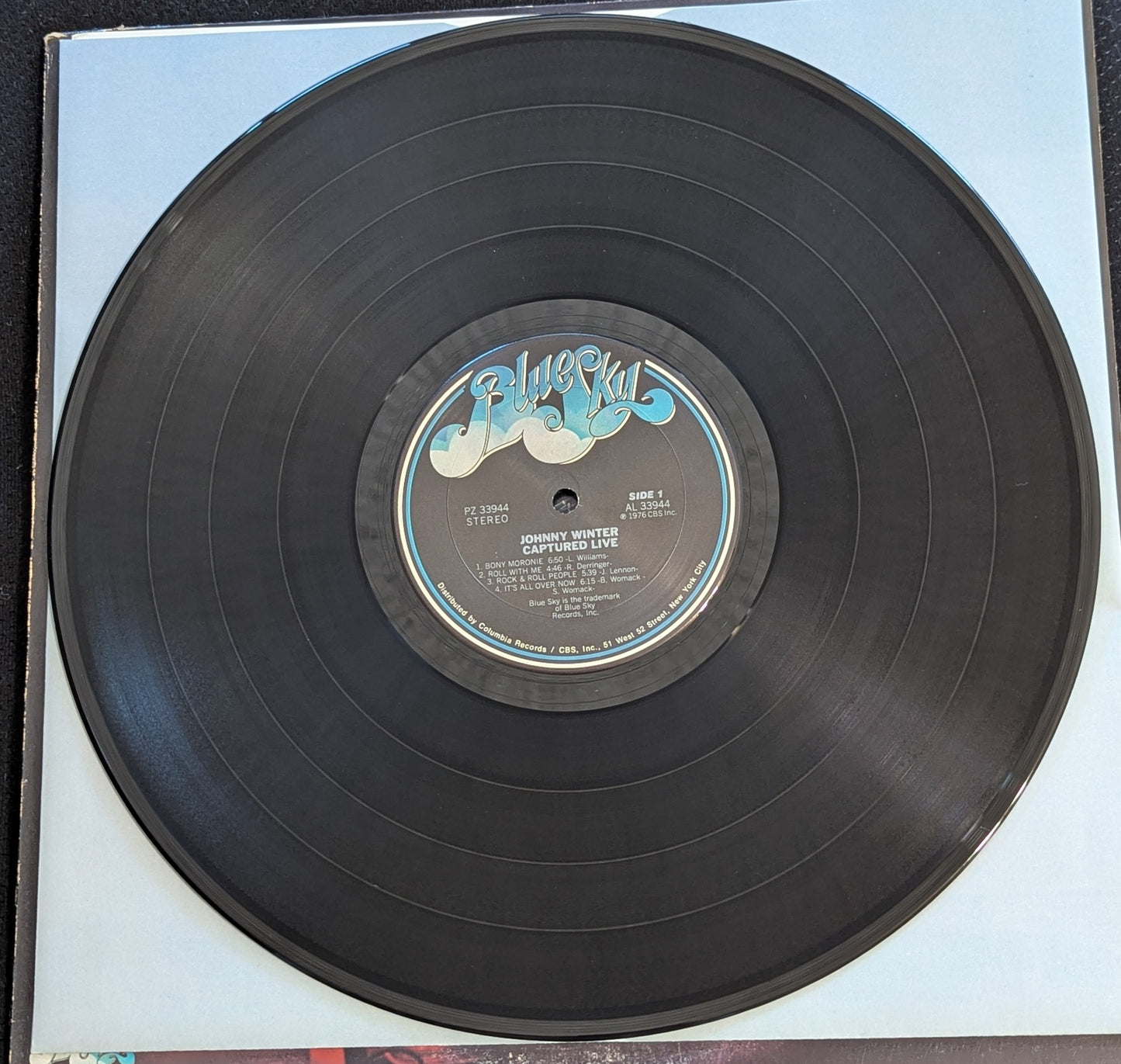 JOHNNY WINTER Captured Live LP Vinyl Record 1976 Blue Sky PZ 33944 (VG Vinyl, G+ Sleeve)