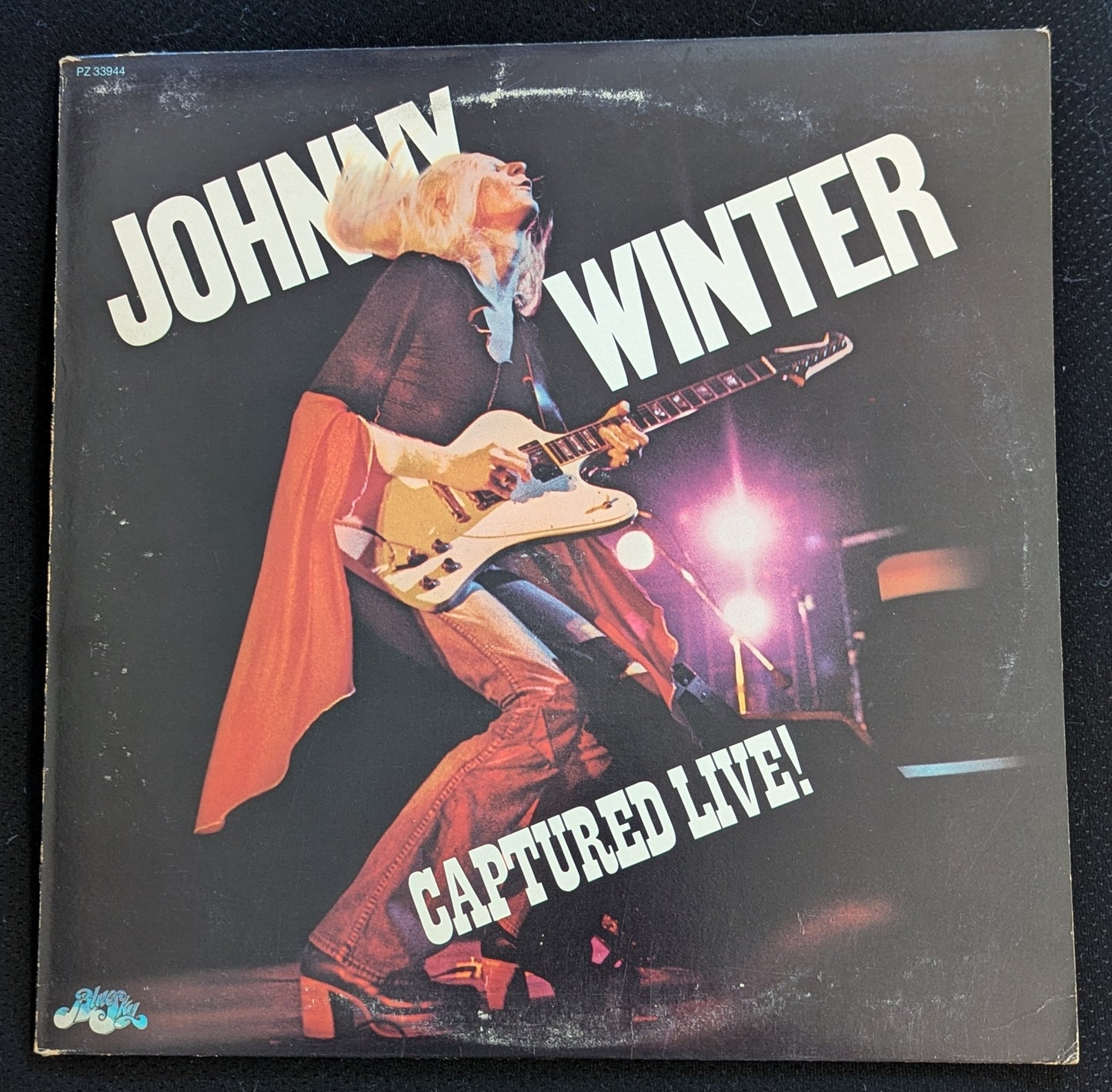 JOHNNY WINTER Captured Live LP Vinyl Record 1976 Blue Sky PZ 33944 (VG Vinyl, G+ Sleeve)